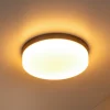 Lucide LED-loftlampe til badeværelset Biskit, sort, Ø 23 cm, plast