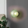 Reality Leuchten LED-væglampe Earl, messing/grøn, glas, Ø 15,5 cm