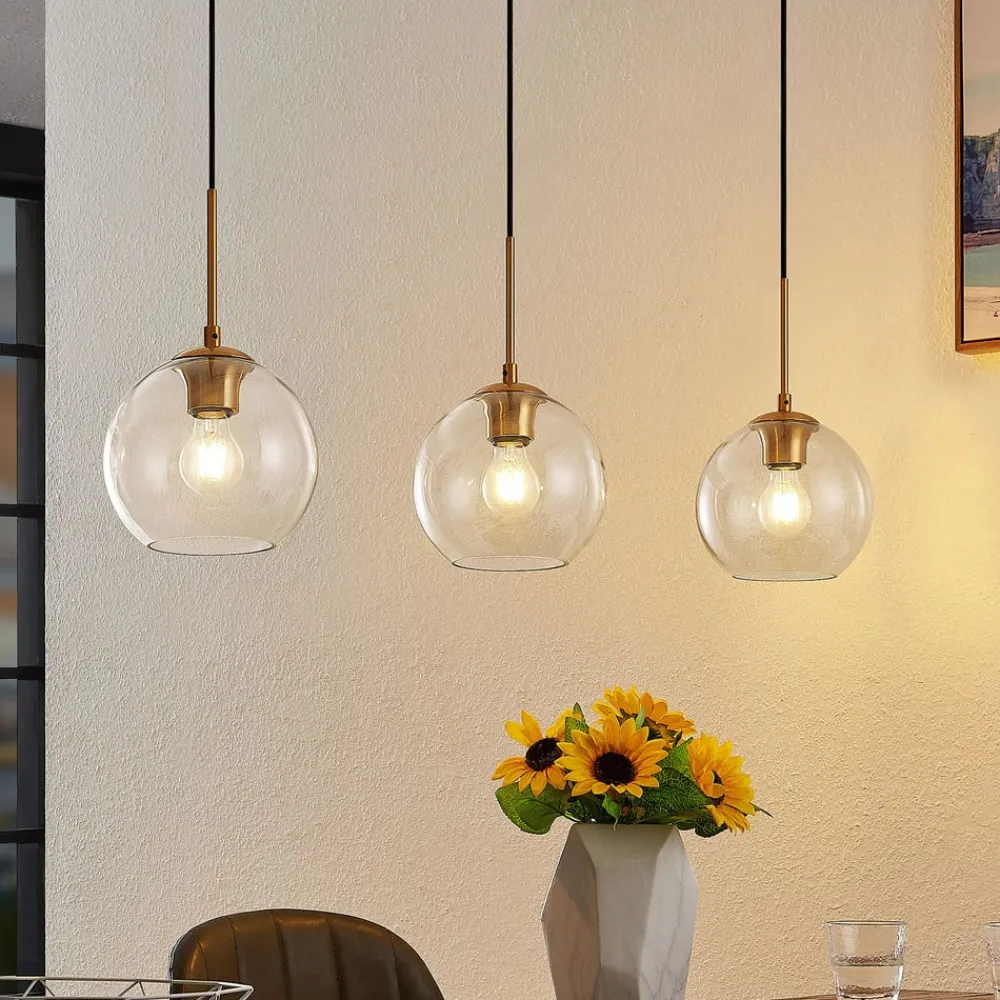 Grady hængelampe, messing/klar, 110 cm, metal, glas^Lindby Outlet