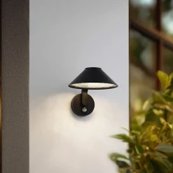 Lindby LED-væglampe Capelo, sort, metal, sensor, Ø20cm