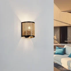 væglampe Yaelle, 20 cm høj, rattan, sort, E27^Lindby Best