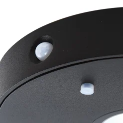 Lucande LED-solcelle-væglampe Tavon, rund, sort, sensor