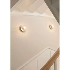 Nuura Aps Nuura Liila 1 væglampe, Ø 14 cm, IP44, sølv/klar