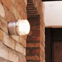 Oluce Væg- Og Spejllamper>Fresnel - Væglampe med glaslinse IP44 krom