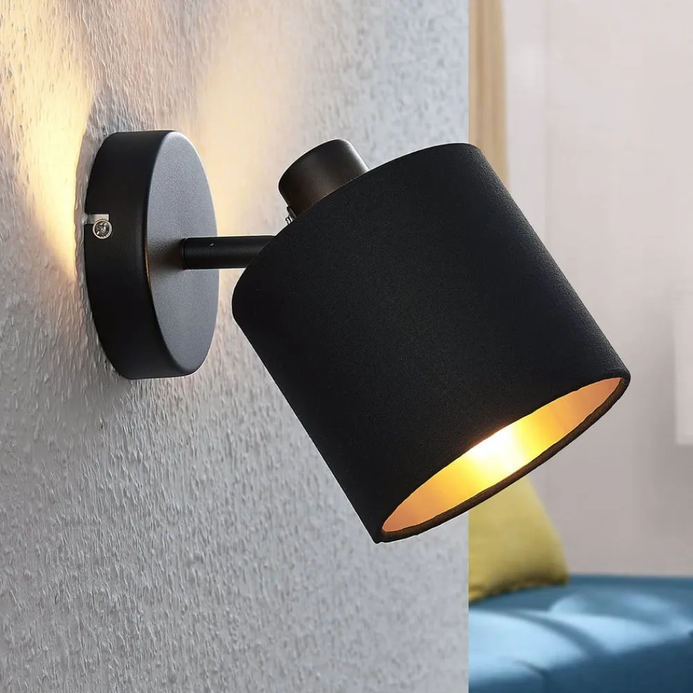 Vasilia væglampe i sort og guld, 1 lyskilde.^Lindby